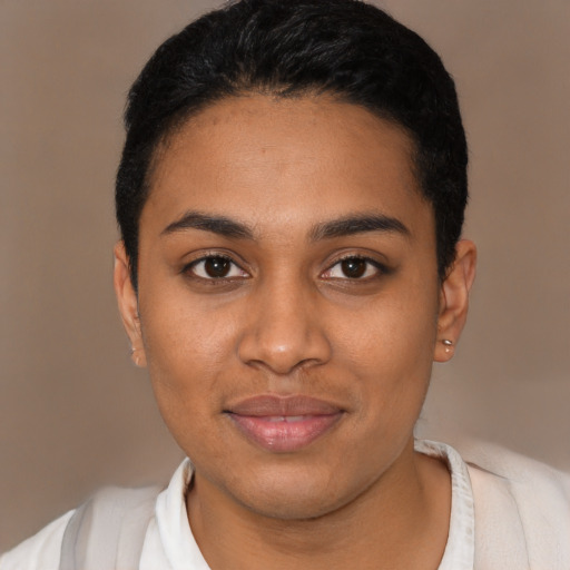 Joyful latino young-adult female with short  black hair and brown eyes