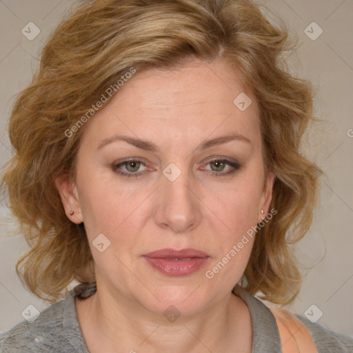 Joyful white adult female with medium  brown hair and blue eyes