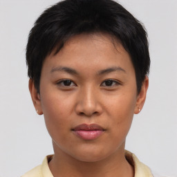 Joyful asian young-adult female with short  brown hair and brown eyes