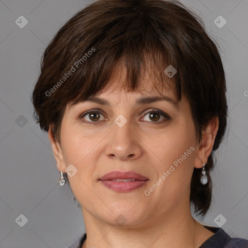 Joyful white adult female with medium  brown hair and brown eyes