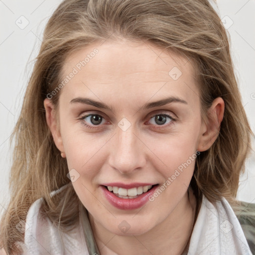 Joyful white young-adult female with medium  brown hair and blue eyes