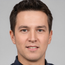 Joyful white adult male with short  brown hair and brown eyes