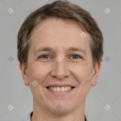 Joyful white adult male with short  brown hair and grey eyes