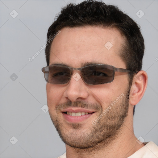 Joyful white adult male with short  brown hair and brown eyes