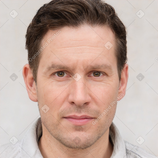 Joyful white adult male with short  brown hair and grey eyes