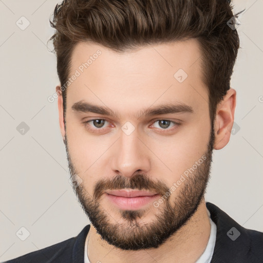 Neutral white young-adult male with short  brown hair and brown eyes