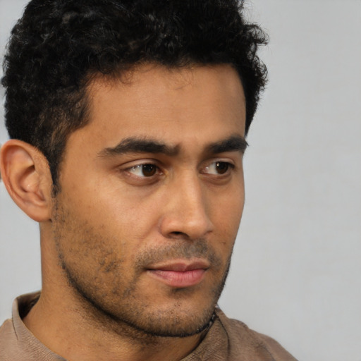 Neutral latino young-adult male with short  brown hair and brown eyes