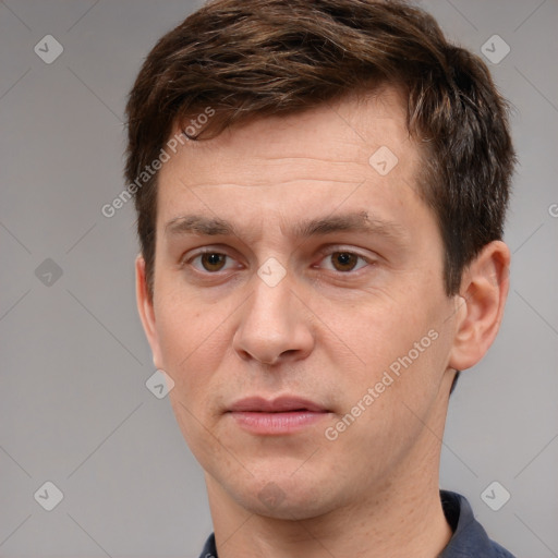 Joyful white adult male with short  brown hair and grey eyes