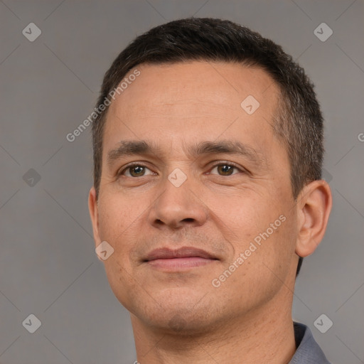 Joyful white adult male with short  brown hair and brown eyes