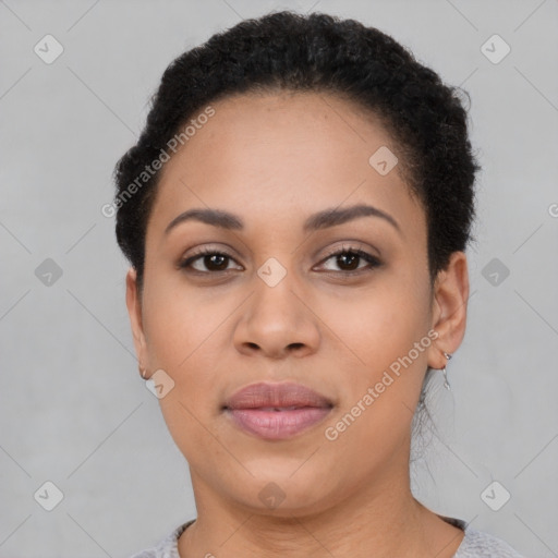 Joyful latino young-adult female with short  brown hair and brown eyes