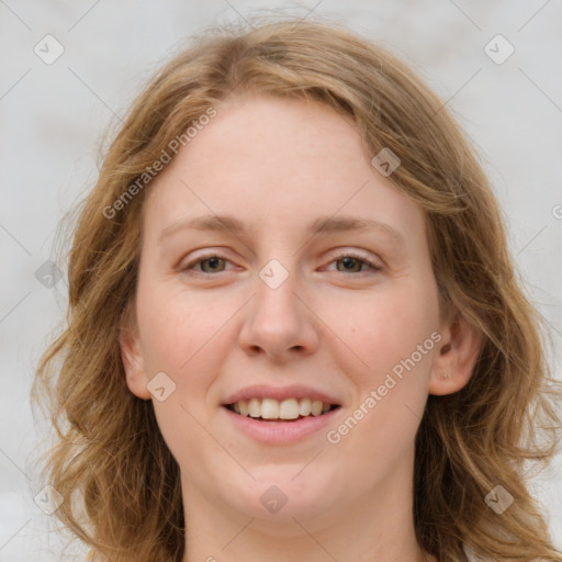 Joyful white young-adult female with long  brown hair and blue eyes