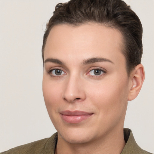 Joyful white young-adult female with short  brown hair and brown eyes