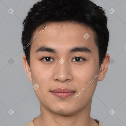 Joyful asian young-adult male with short  black hair and brown eyes