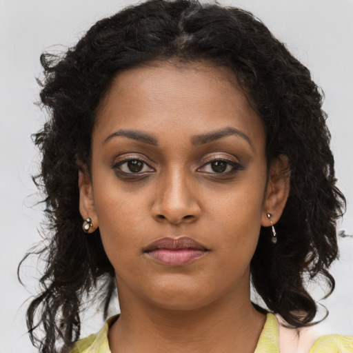 Neutral black young-adult female with long  brown hair and brown eyes