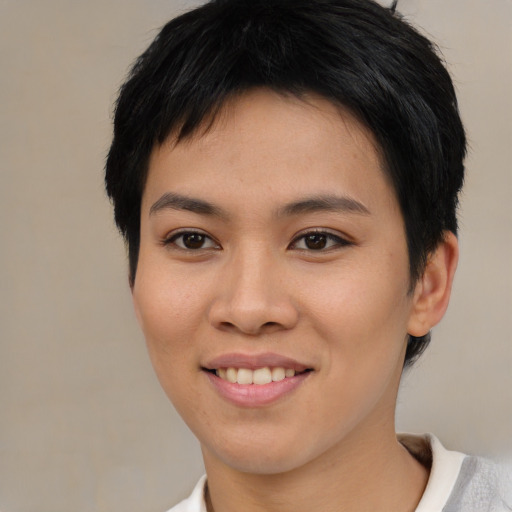 Joyful asian young-adult female with short  brown hair and brown eyes