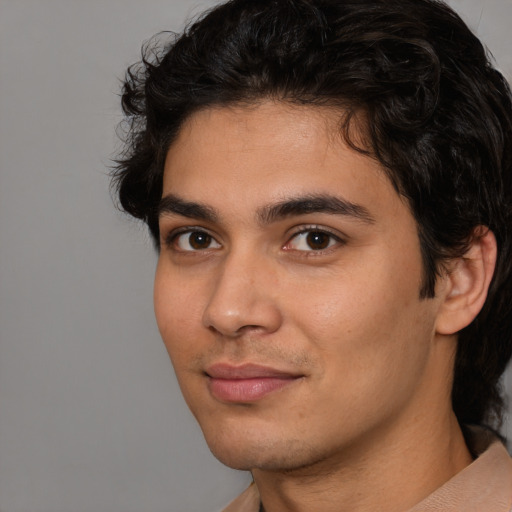 Joyful white young-adult male with medium  brown hair and brown eyes