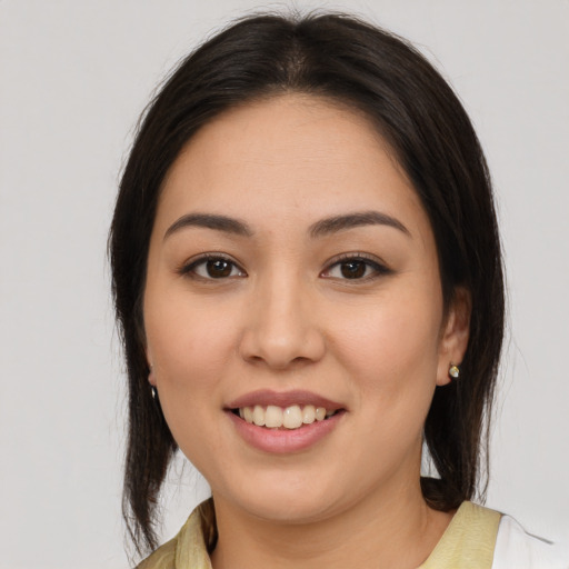 Joyful white young-adult female with medium  brown hair and brown eyes