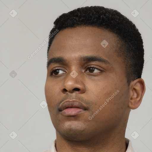 Neutral black young-adult male with short  black hair and brown eyes