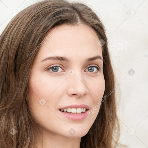 Joyful white young-adult female with long  brown hair and blue eyes