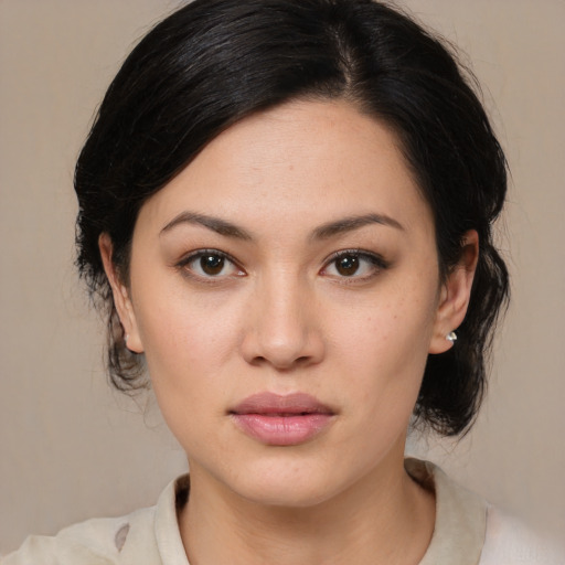 Joyful asian young-adult female with medium  brown hair and brown eyes