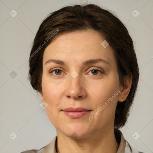 Joyful white adult female with medium  brown hair and grey eyes