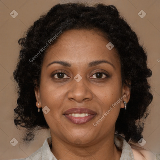 Joyful black adult female with medium  brown hair and brown eyes