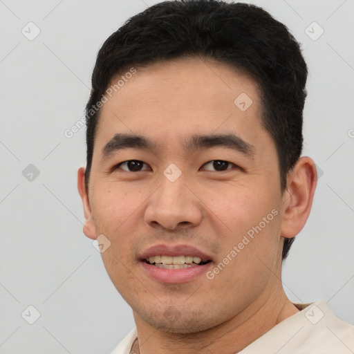 Joyful white young-adult male with short  black hair and brown eyes