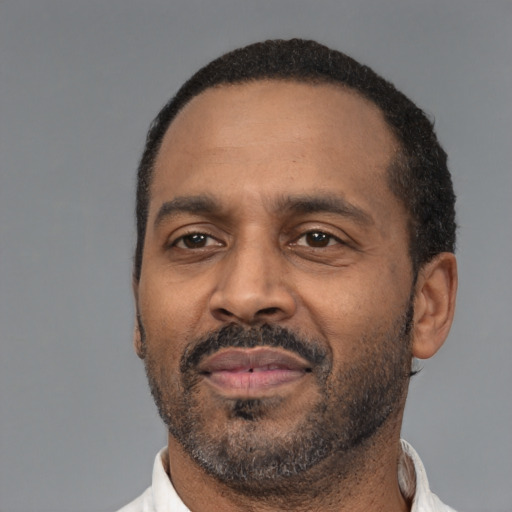 Neutral latino adult male with short  black hair and brown eyes