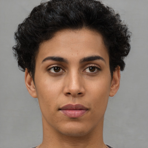 Joyful latino young-adult female with short  brown hair and brown eyes