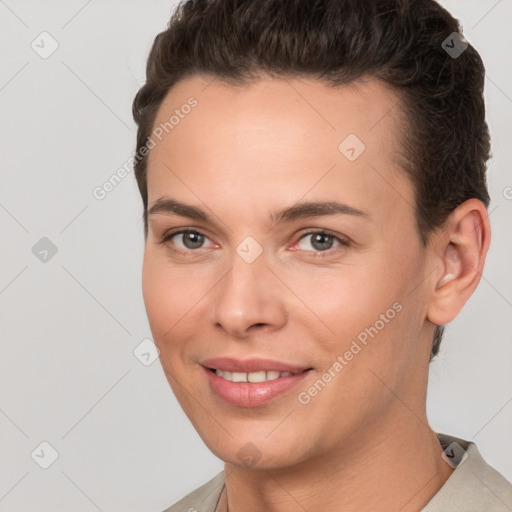 Joyful white young-adult female with short  brown hair and brown eyes