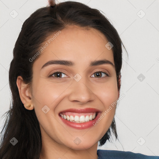 Joyful white young-adult female with long  brown hair and brown eyes