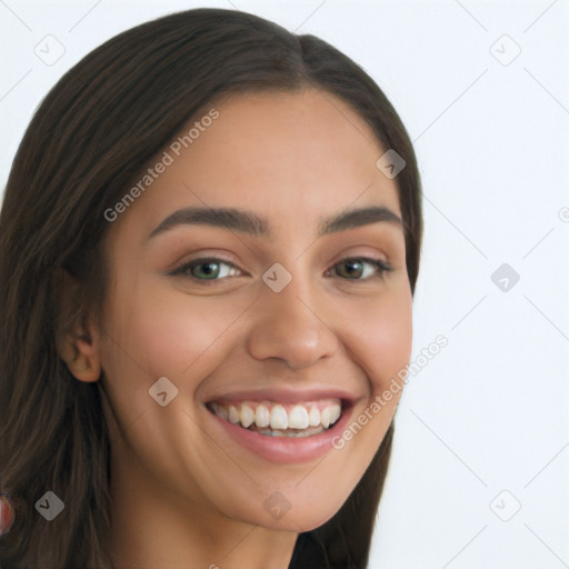 Joyful latino young-adult female with long  brown hair and brown eyes