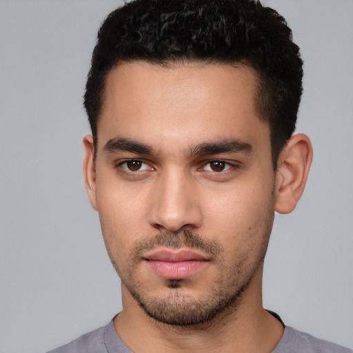 Neutral white young-adult male with short  black hair and brown eyes
