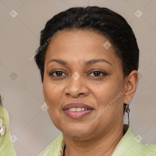 Joyful latino adult female with short  brown hair and brown eyes