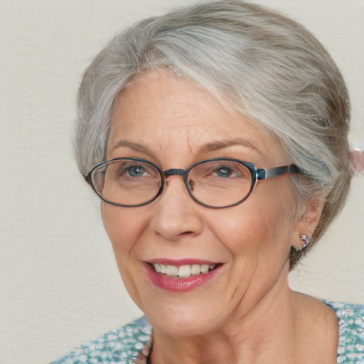 Joyful white middle-aged female with medium  gray hair and blue eyes