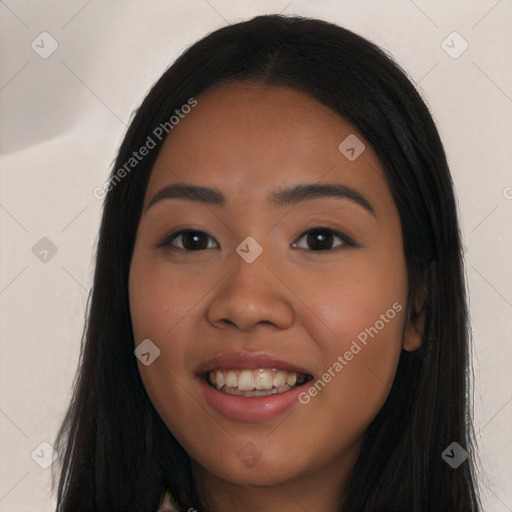 Joyful latino young-adult female with long  black hair and brown eyes