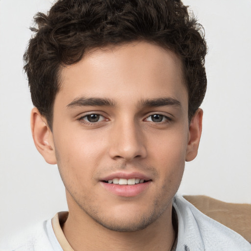 Joyful white child male with short  brown hair and brown eyes