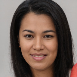 Joyful asian young-adult female with long  brown hair and brown eyes