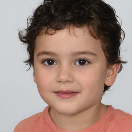 Joyful white child male with medium  brown hair and brown eyes