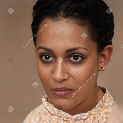 Joyful black young-adult female with short  brown hair and brown eyes