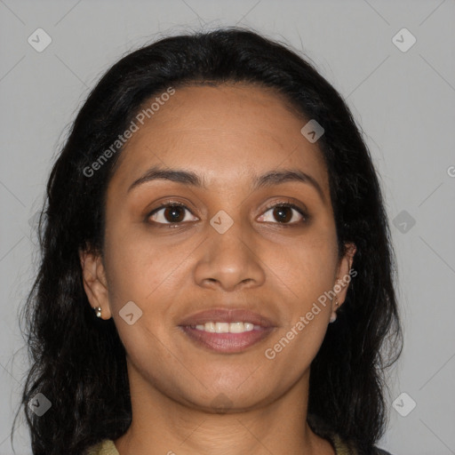 Joyful black young-adult female with long  brown hair and brown eyes