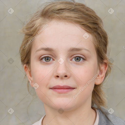 Joyful white child female with medium  brown hair and blue eyes