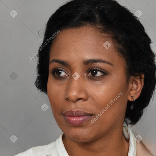 Joyful black young-adult female with short  brown hair and brown eyes