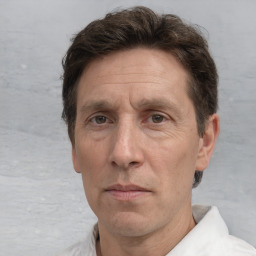 Neutral white middle-aged male with short  brown hair and brown eyes