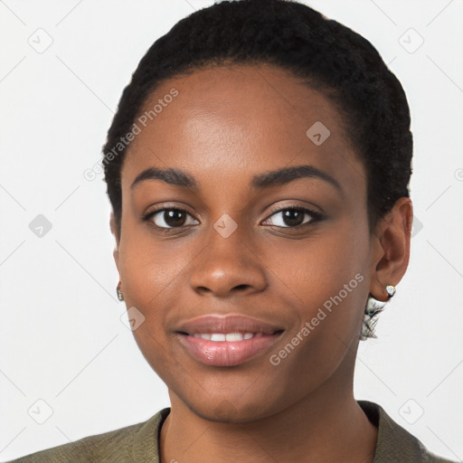 Joyful black young-adult female with short  black hair and brown eyes