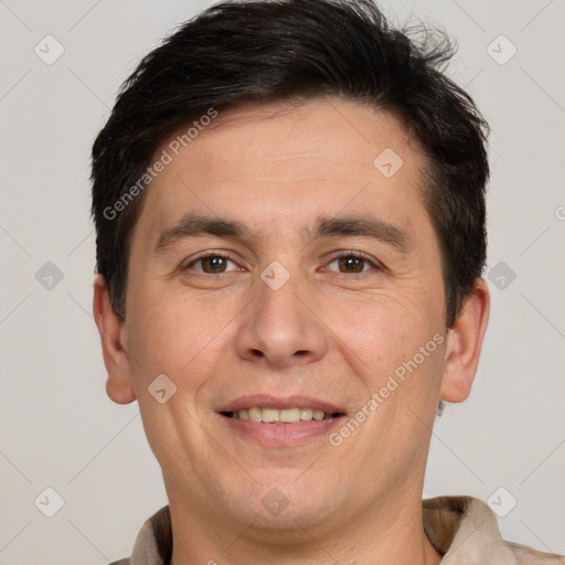 Joyful white adult male with short  brown hair and brown eyes