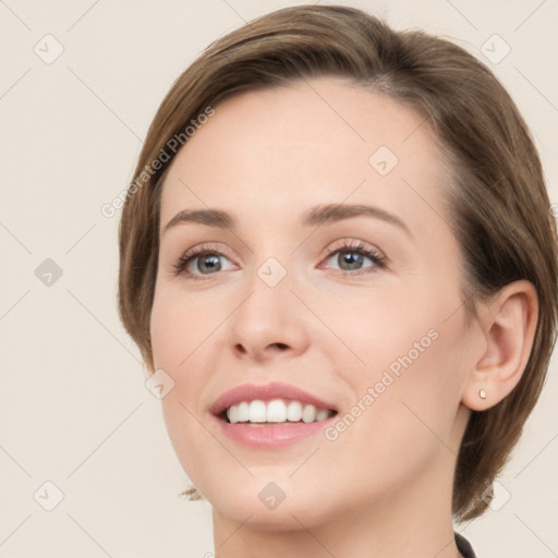 Joyful white young-adult female with medium  brown hair and green eyes