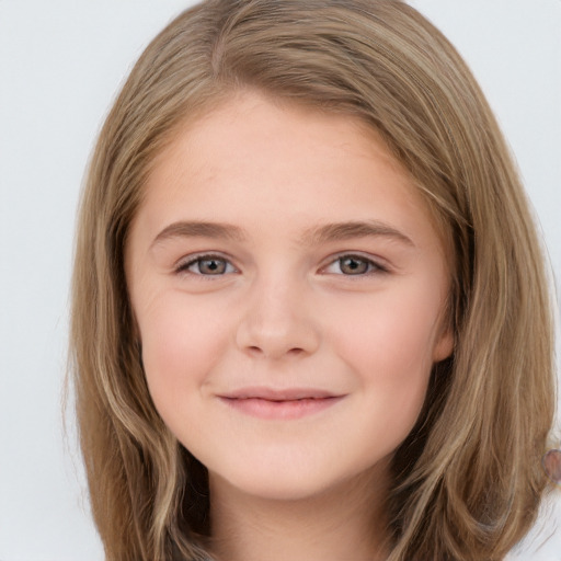 Joyful white child female with long  brown hair and brown eyes