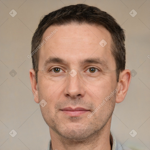 Joyful white adult male with short  brown hair and brown eyes