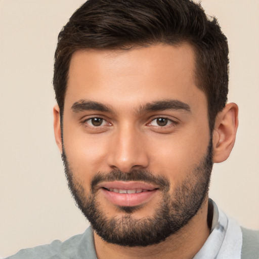 Joyful white young-adult male with short  brown hair and brown eyes